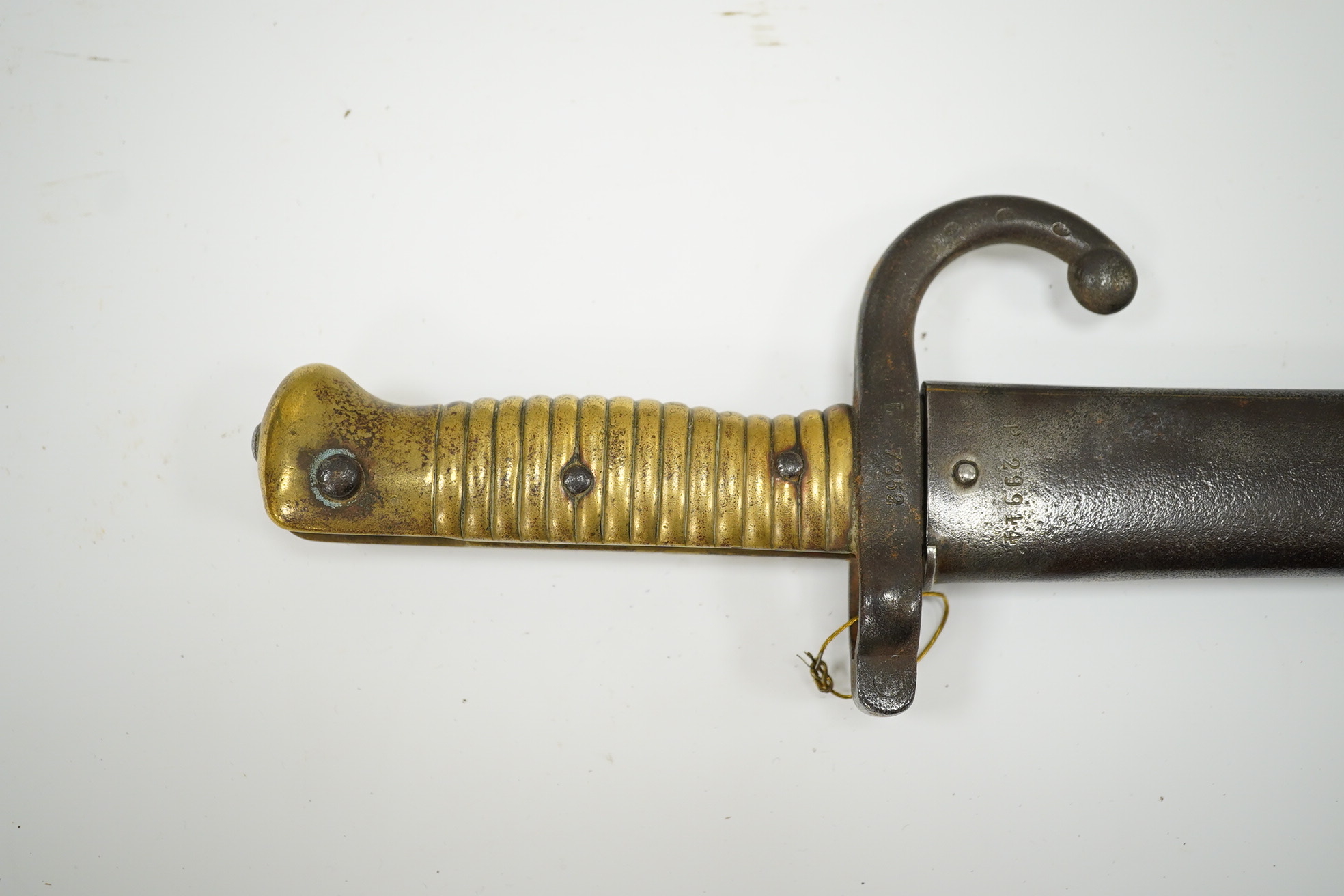 A French bayonet for a chassepot rifle, regulation blade dated 1871 and regulation hilt, in its iron scabbard. Condition - fair